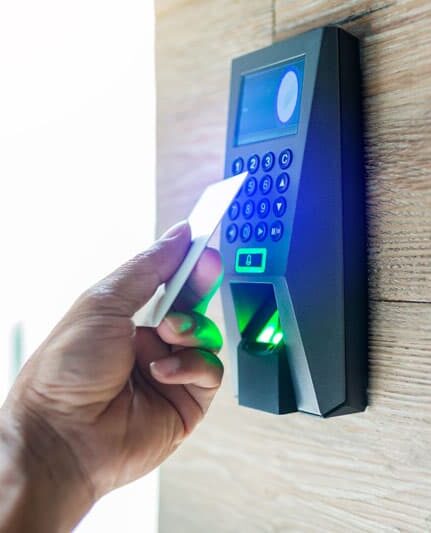 Door access control. Staff holding a key card to lock and unlock door at home or condominium. using electronic card key for access. electronic key and finger scan access control system to unlock doors
